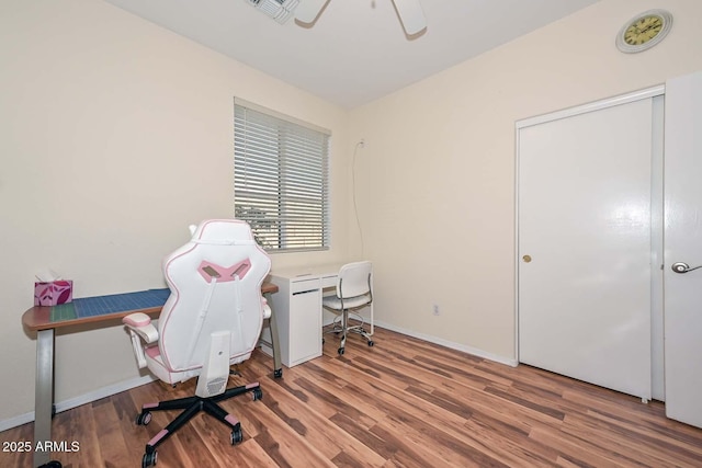 11580 N 86th Ln, Peoria, AZ 85345 - home office featuring wood finished floors and a ceiling fan