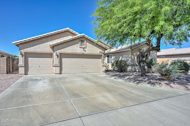 11580 N 86th Ln, Peoria, AZ 85345 - ranch-style home with stucco siding, driveway, an attached garage, and a tiled roof