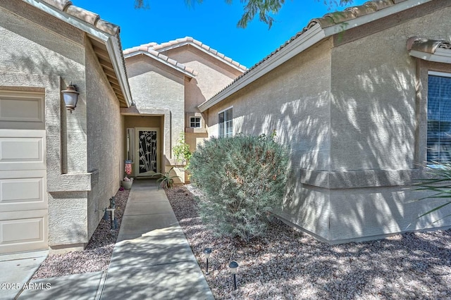 11580 N 86th Ln, Peoria, AZ 85345 - property entrance with stucco siding and a tile roof