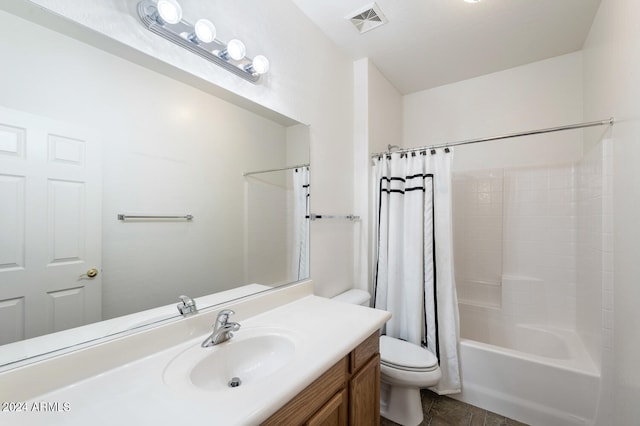 full bathroom featuring shower / tub combo with curtain, vanity, and toilet