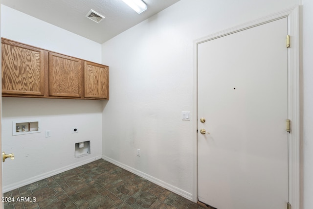 washroom with electric dryer hookup, cabinets, and washer hookup