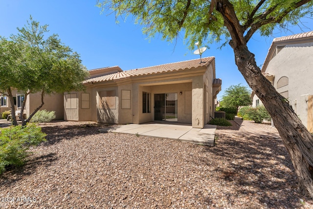 rear view of property with a patio area