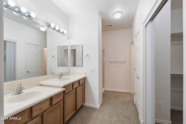 bathroom with vanity and an enclosed shower