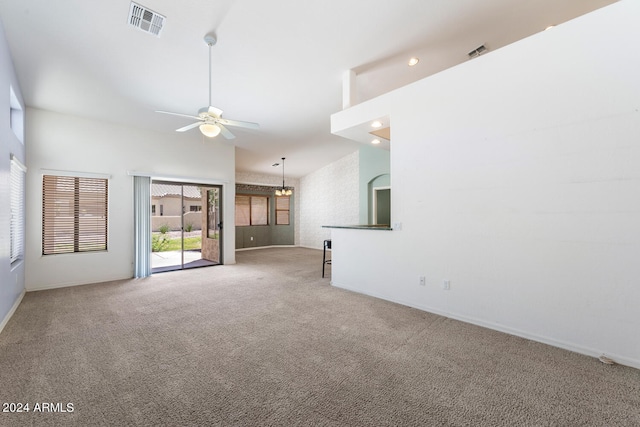 unfurnished living room featuring carpet flooring, ceiling fan, and high vaulted ceiling