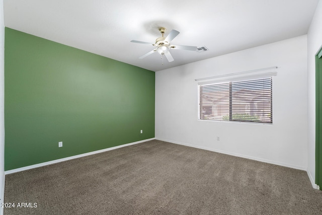 unfurnished room with carpet flooring and ceiling fan