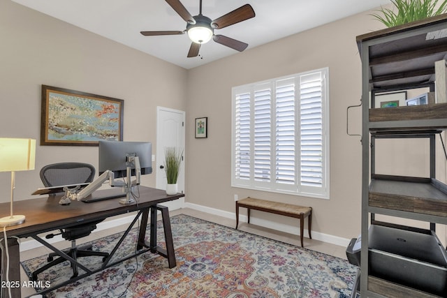 home office with ceiling fan and light tile patterned floors