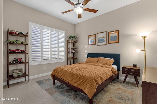 bedroom with ceiling fan and light tile patterned floors