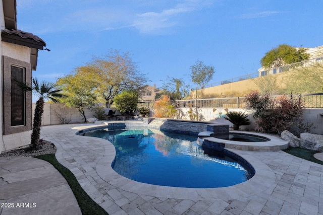 view of swimming pool with an in ground hot tub and a patio