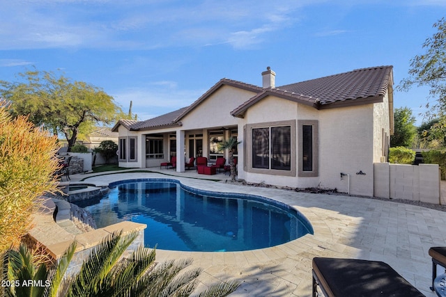 view of pool featuring an in ground hot tub and a patio area