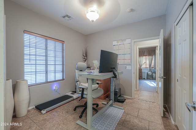 office area with light tile patterned flooring