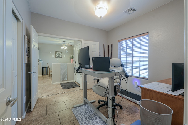 office space with ceiling fan and light tile patterned flooring