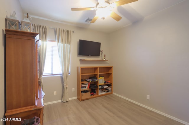 misc room featuring ceiling fan and light wood-type flooring