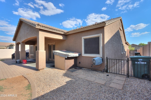 back of property with a patio