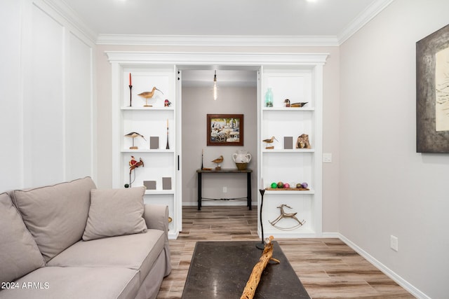 living room featuring wood-type flooring and crown molding