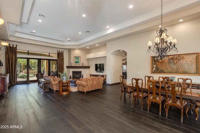 26156 N 88th Way, Scottsdale, AZ 85255 - living area featuring a raised ceiling, arched walkways, dark wood-style flooring, recessed lighting, and a chandelier