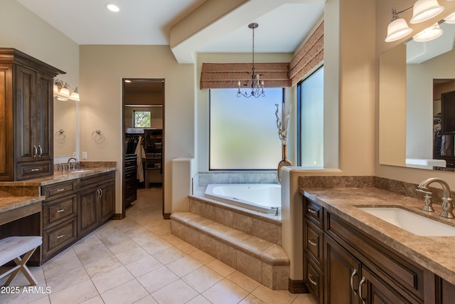 26156 N 88th Way, Scottsdale, AZ 85255 - bathroom with a chandelier, two vanities, a garden tub, tile patterned floors, and a spacious closet