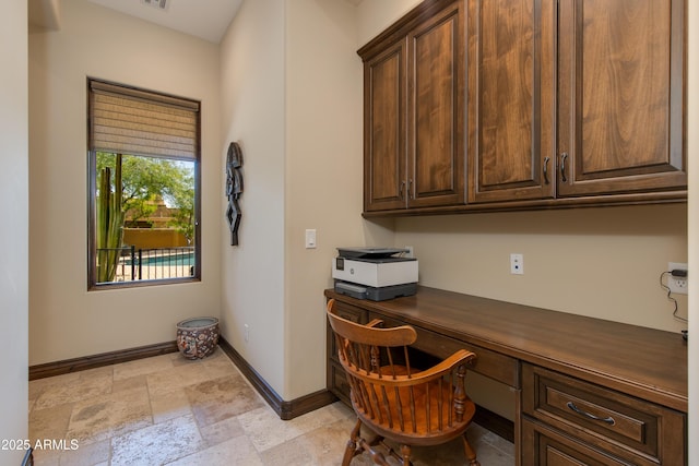 26156 N 88th Way, Scottsdale, AZ 85255 - office space with built in study area, baseboards, and stone tile flooring