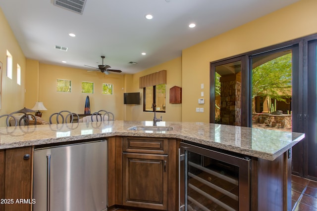 26156 N 88th Way, Scottsdale, AZ 85255 - kitchen featuring fridge, wine cooler, a sink, plenty of natural light, and recessed lighting