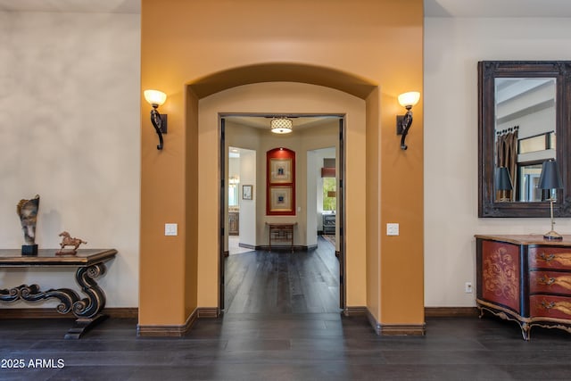 26156 N 88th Way, Scottsdale, AZ 85255 - hall featuring arched walkways, dark wood-style flooring, and baseboards