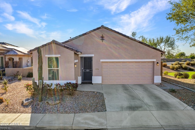 ranch-style home featuring a garage