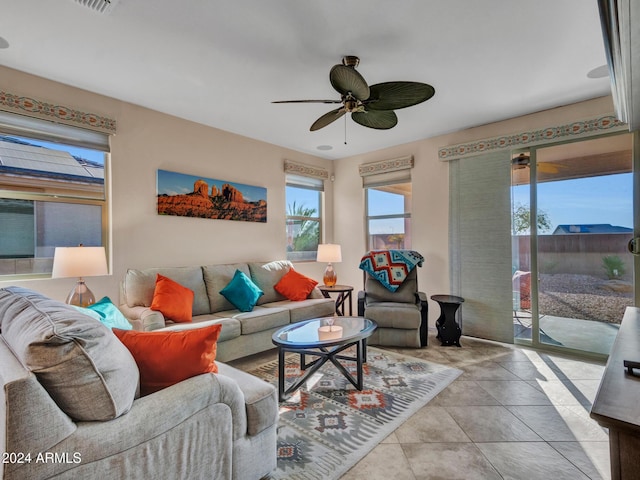 tiled living room with ceiling fan