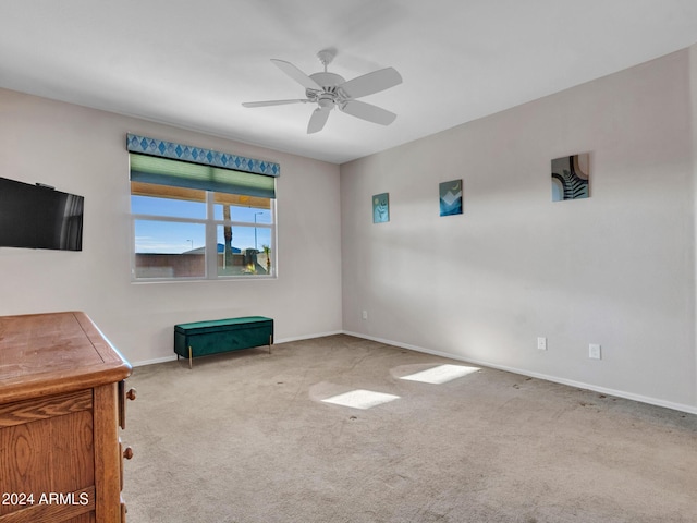 interior space featuring carpet and ceiling fan