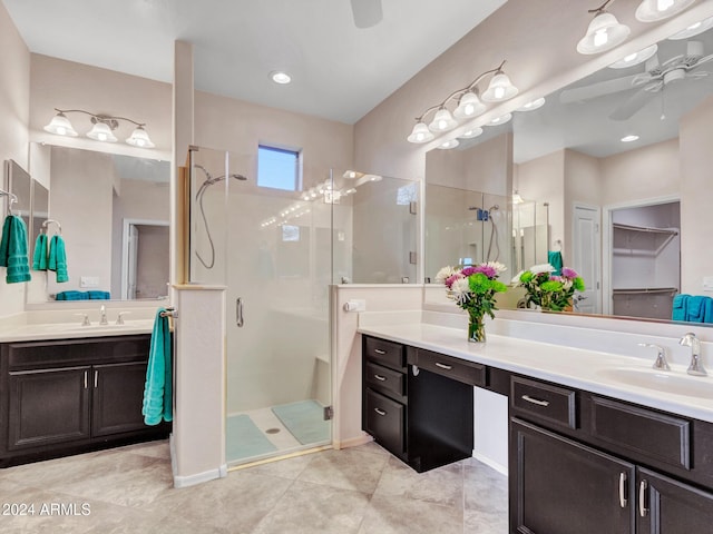 bathroom featuring tile patterned flooring, ceiling fan, walk in shower, and vanity