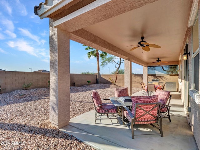 view of patio featuring ceiling fan