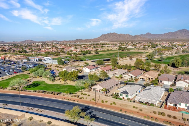 birds eye view of property with a mountain view