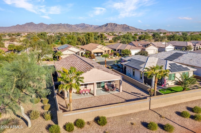 birds eye view of property with a mountain view