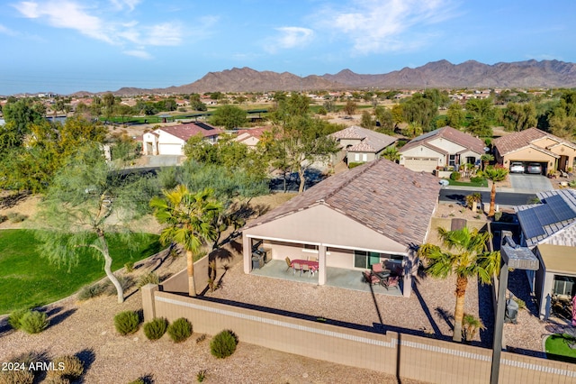 birds eye view of property with a mountain view