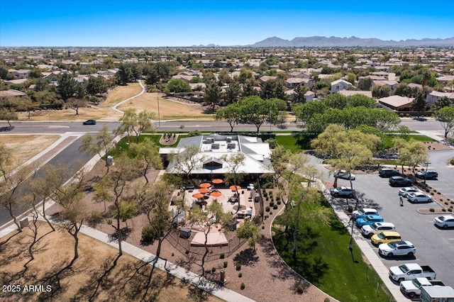 aerial view of residential area featuring a mountain backdrop