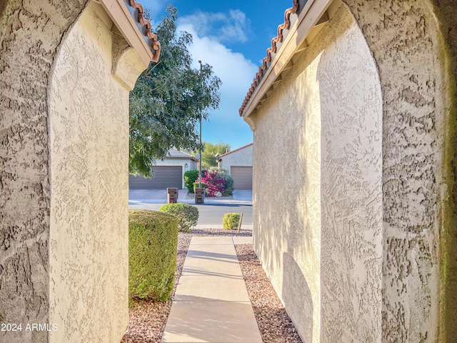 view of side of property with a garage and an outdoor structure