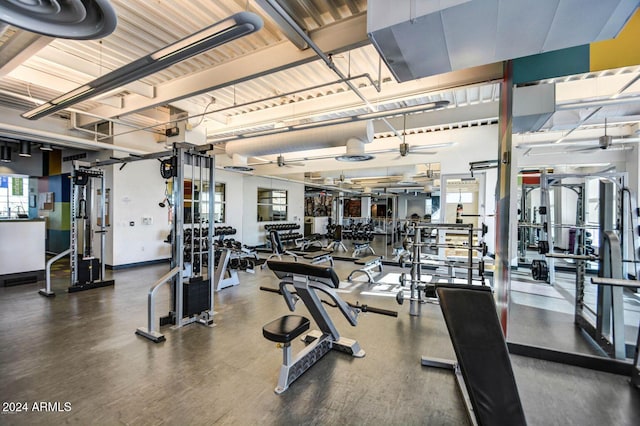 exercise room with ceiling fan