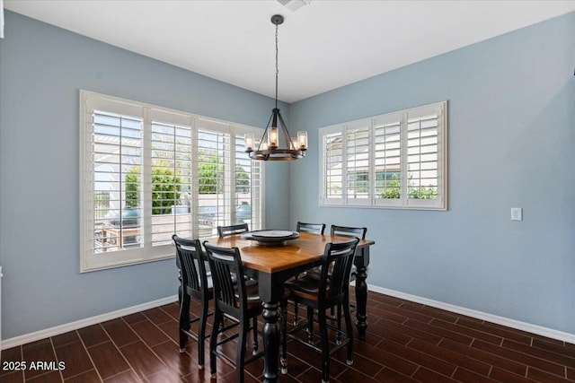 6788 S Jacqueline Way, Gilbert, AZ 85298 - dining space with baseboards, an inviting chandelier, and wood tiled floor