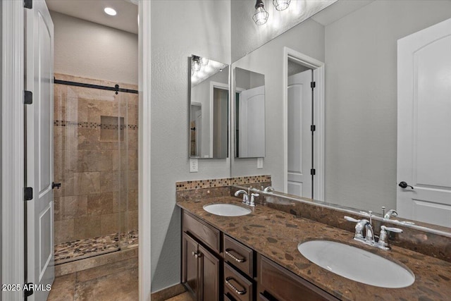 6788 S Jacqueline Way, Gilbert, AZ 85298 - bathroom with a shower stall, double vanity, and a sink