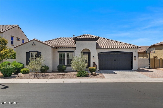 6788 S Jacqueline Way, Gilbert, AZ 85298 - mediterranean / spanish-style house with stucco siding, fence, a tile roof, a garage, and driveway