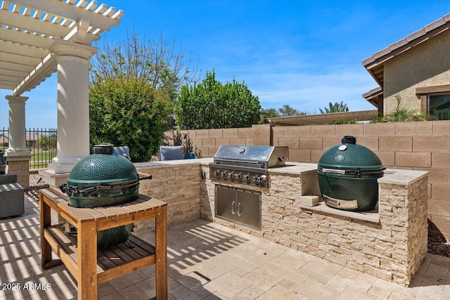 6788 S Jacqueline Way, Gilbert, AZ 85298 - view of patio / terrace featuring grilling area, a pergola, fence, and an outdoor kitchen