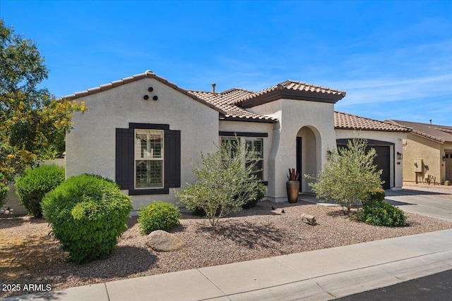 6788 S Jacqueline Way, Gilbert, AZ 85298 - mediterranean / spanish-style home with a garage, stucco siding, driveway, and a tile roof