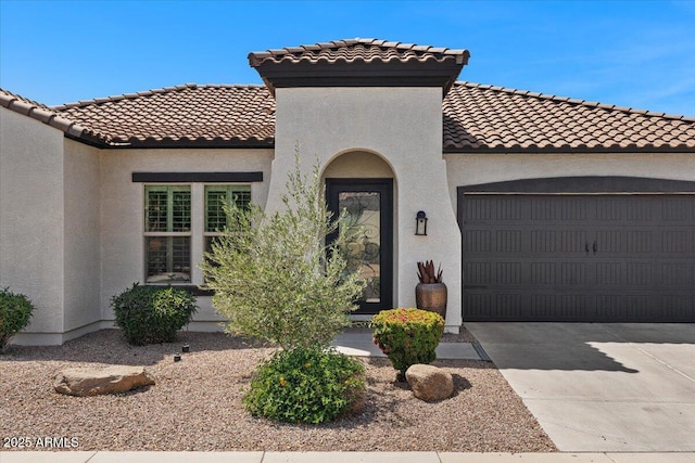 6788 S Jacqueline Way, Gilbert, AZ 85298 - mediterranean / spanish-style home with concrete driveway, stucco siding, a tiled roof, and a garage