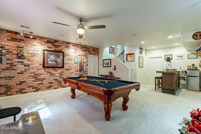 kitchen with beverage cooler, appliances with stainless steel finishes, dark wood-type flooring, and a kitchen island