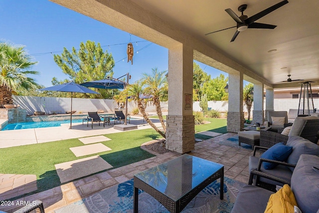 view of patio / terrace featuring a fenced backyard, a fenced in pool, an outdoor living space, and a ceiling fan