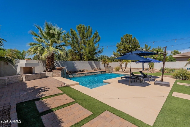 view of swimming pool with a fenced backyard, a fenced in pool, and a patio