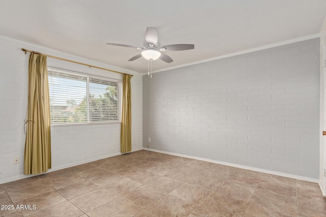 spare room featuring crown molding, ceiling fan, and baseboards
