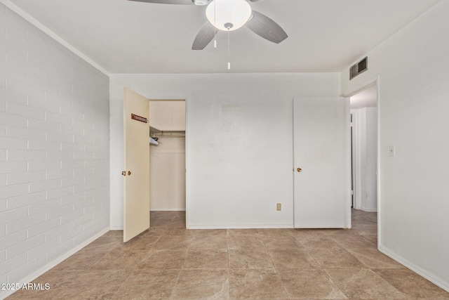 unfurnished bedroom with visible vents, ceiling fan, a closet, and baseboards