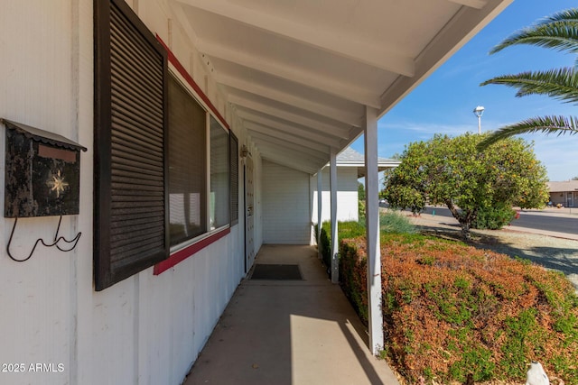view of side of property featuring a porch