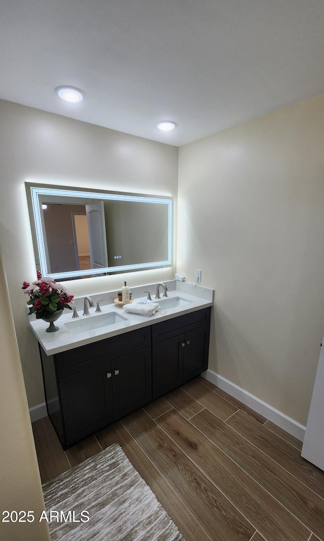 bathroom with vanity and hardwood / wood-style floors