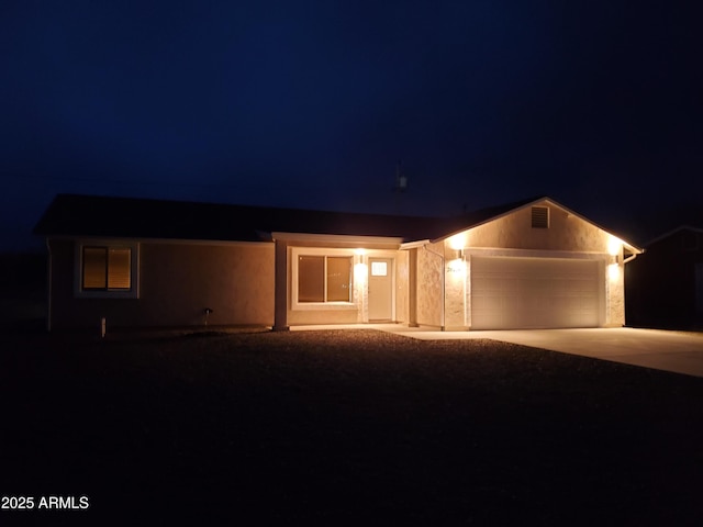 ranch-style home featuring a garage