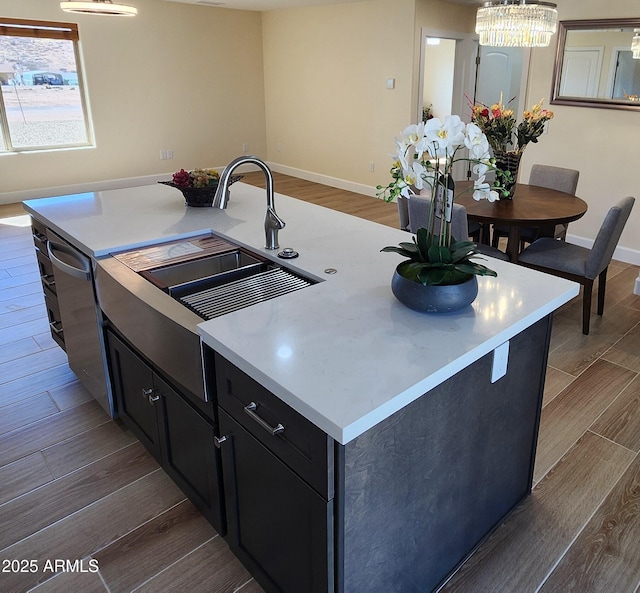 kitchen with sink and a kitchen island with sink