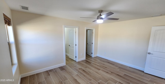 unfurnished bedroom with ceiling fan and light hardwood / wood-style flooring